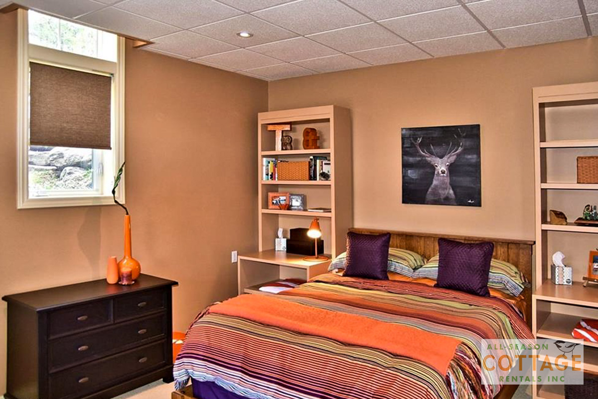 Bedroom #4 is located in lower level with a Queen bed